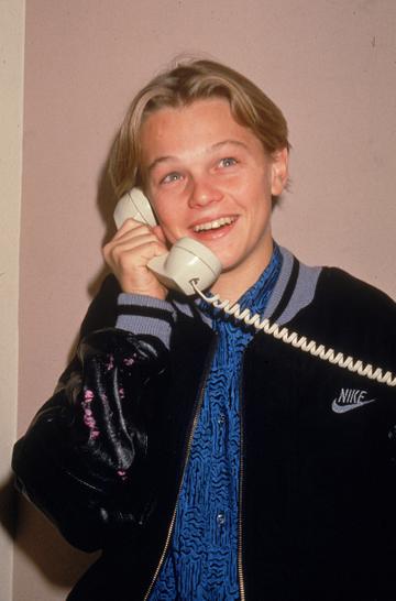 American actor Leonardo DiCaprio talks on the telephone, circa 1989. DiCaprio starred in his first role in 1989 at the tender age of 15. (Photo by Darlene Hammond/Getty Images)