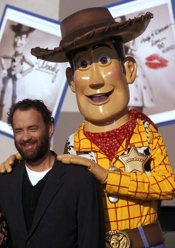 1999:   Actor Tom Hanks and Woody attend the "Toy Story 2" Themed NASCAR Racing Cars Unveiling on October 23, 1999 at the El Capitan Theatre in Hollywood, California. (Photo by Ron Galella, Ltd./Ron Galella Collection via Getty Images)