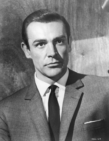 1963:  Scottish actor Sean Connery wears a suit jacket and a tie as James Bond in a still from director Terence Young's film, 'From Russia with Love'.  (Photo by Hulton Archive/Getty Images)