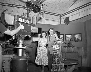 American actress Betty White (left), actor Eddie Albert (1906 - 2005), and an unidentified woman pose in front of the a KLAC-TV camera during a broadcast of the talk show, 'Hollywood on Television,' Los Angeles, California, 1952. (Photo by Nigel Dobinson/Getty Images)