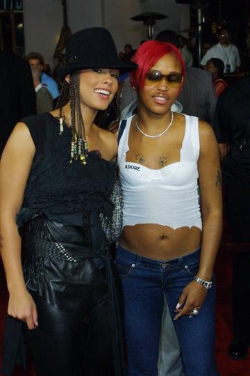 2001: Singer Alicia Keys (l) and rapper Eve (r) arrive at the Hard Rock Charity Jam for Hollywoodcharities.org August 29, 2001 in Universal City, CA. (Photo by Jason Kirk/Getty Images)