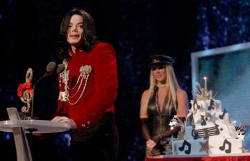 Michael Jackson speaks after Britney Spears presented Michael with a birthday cake at the 2002 MTV Video Music Awards. Britney referred to Michael Jackson as 'the artist of the millennium', causing Michael to accept the non-existent MTV Artist of the Millennium award.

(Photo by KMazur/WireImage)