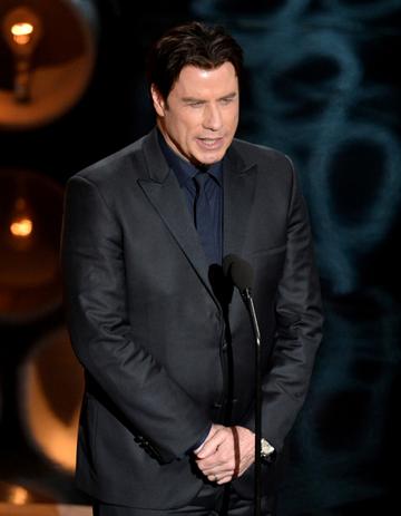 John Travolta struggled to pronounce Idina Menzel's name during the 2014 Oscars, instead calling her 'Adele Dazeem'.  (Photo by Kevin Winter/Getty Images)