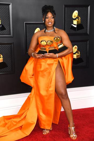 Megan Thee Stallion, winner of the Best Rap Performance and Best Rap Song awards for 'Savage' and the Best New Artist award, poses in the media room during the 63rd Annual GRAMMY Awards at Los Angeles Convention Center on March 14, 2021 in Los Angeles, California. (Photo by Kevin Mazur/Getty Images for The Recording Academy )