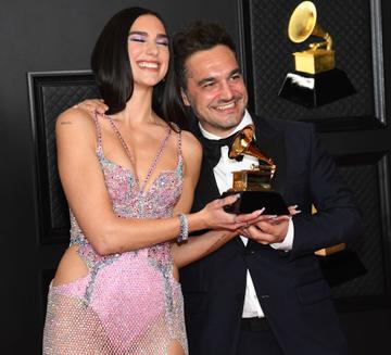 (L-R) Dua Lipa, winner of Best Pop Vocal Album for ‘Future Nostalgia’, and Ben Mawson pose in the media room during the 63rd Annual GRAMMY Awards at Los Angeles Convention Center on March 14, 2021 in Los Angeles, California. (Photo by Kevin Mazur/Getty Images for The Recording Academy )