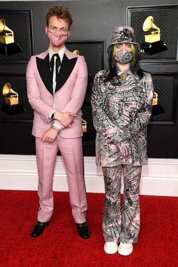 (L-R) FINNEAS and Billie Eilish attend the 63rd Annual GRAMMY Awards at Los Angeles Convention Center on March 14, 2021 in Los Angeles, California. (Photo by Kevin Mazur/Getty Images for The Recording Academy )