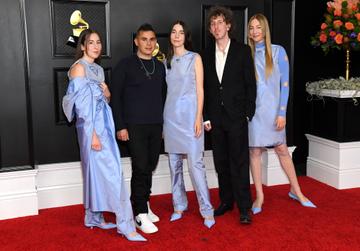 (L-R) Alana Haim, Rostam Batmanglij, Danielle Haim, Ariel Rechtshaid and Este Haim of HAIM attend the 63rd Annual GRAMMY Awards at Los Angeles Convention Center on March 14, 2021 in Los Angeles, California. (Photo by Kevin Mazur/Getty Images for The Recording Academy )