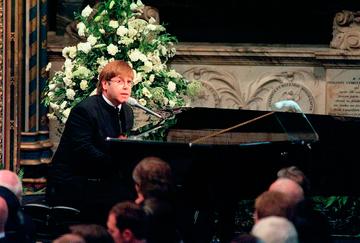 LONDON - SEPTEMBER 6:  Sir Elton John sings 'Candle in the Wind' at the funeral if Diana, Princess of Wales at Westminster Abbey on September 6, 1997 in London, England. (Photo by Anwar Hussein/Getty Images)