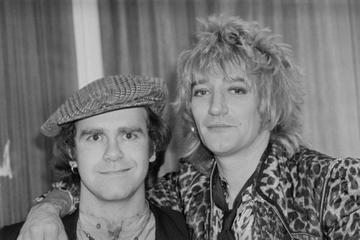 British singer, pianist and composer Elton John with British rock singer and songwriter Rod Stewart at the Olympia, London, UK, 22nd December 1978. (Photo by Evening Standard/Hulton Archive/Getty Images)