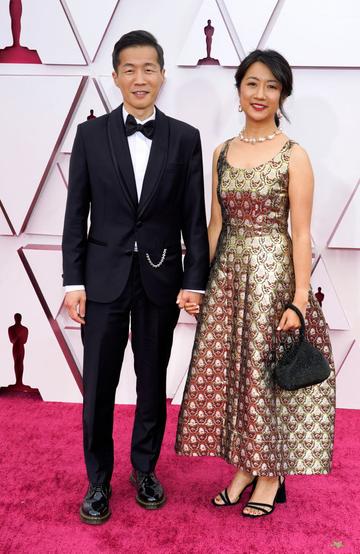 (L-R) Lee Isaac Chung and Valerie Chung attend the 93rd Annual Academy Awards at Union Station on April 25, 2021 in Los Angeles, California. (Photo by Chris Pizzello-Pool/Getty Images)