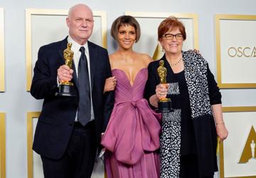 Donald Graham Burt (L) and Jan Pascale (R), winners of Best Production Design for "Mank", pose with Halle Berry (C) in the press room during the Oscars on Sunday, April 25, 2021, at Union Station in Los Angeles. (Photo by Chris Pizzello-Pool/Getty Images)