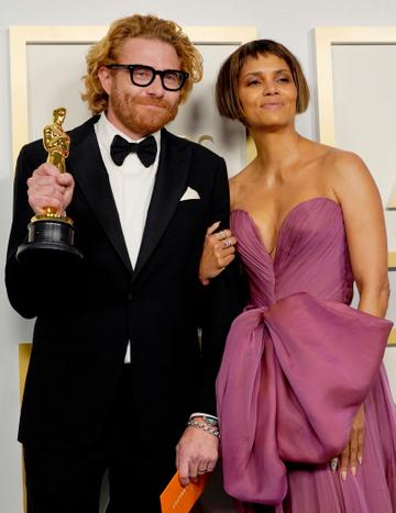 Erik Messerschmidt, winner of Best Cinematography for "Mank", poses with Halle Berry in the press room during the Oscars on Sunday, April 25, 2021, at Union Station in Los Angeles. (Photo by Chris Pizzello-Pool/Getty Images)