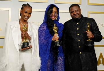 Tiara Thomas, H.E.R., and Dernst Emile II, winners of Best Original Song for "Fight For You" from "Judas and the Black Messiah," pose in the press room at the Oscars on Sunday, April 25, 2021, at Union Station in Los Angeles. (Photo by Chris Pizzello-Pool/Getty Images)