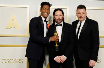 Jon Batiste, Trent Reznor, and Atticus Ross, winners of Best Original Score for "Soul," pose in the press room during the Oscars on Sunday, April 25, 2021, at Union Station in Los Angeles. (Photo by Chris Pizzello-Pool/Getty Images)