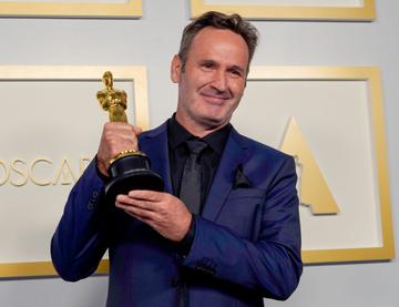  Scott R. Fisher, winner of Best Visual Effects for "Tenet", poses in the press room during the Oscars on Sunday, April 25, 2021, at Union Station in Los Angeles. (Photo by Chris Pizzello-Pool/Getty Images)