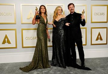 Marlee Matlin (center) poses with Pippa Ehrlich (L) and James Reed (R), winners of Best Documentary Feature for "My Octopus Teacher", in the press room during the Oscars on Sunday, April 25, 2021, at Union Station in Los Angeles. (Photo by Chris Pizzello-Pool/Getty Images)