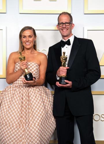Dana Murray and Pete Docter, winners of the Animated Feature Film award for 'Soul,’ pose in the press room during the 93rd Annual Academy Awards at Union Station on April 25, 2021 in Los Angeles, California. (Photo by Matt Petit/A.M.P.A.S. via Getty Images)