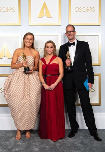 (L-R) Pete Docter, Dana Murray and Reese Witherspoon winners of the Animated Feature Film award for 'Soul' poses in the press room during the 93rd Annual Academy Awards at Union Station on April 25, 2021 in Los Angeles, California. (Photo by Matt Petit/A.M.P.A.S. via Getty Images)
