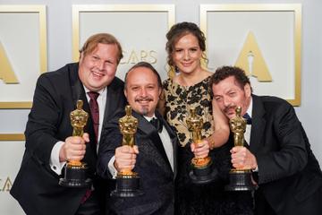 Phillip Bladh, Carlos Cortés, Michelle Couttolenc and Jaime Baksht pose with the Best Sound award for 'The Sound of Metal' in the press room during the 93rd Annual Academy Awards at Union Station on April 25, 2021 in Los Angeles, California. (Photo by Matt Petit/A.M.P.A.S. via Getty Images)