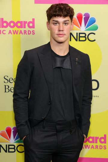 Noah Beck poses backstage for the 2021 Billboard Music Awards, broadcast on May 23, 2021 at Microsoft Theater in Los Angeles, California. (Photo by Rich Fury/Getty Images for dcp)