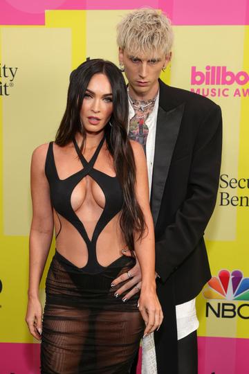 Machine Gun Kelly and Meghan Fox poses backstage for the 2021 Billboard Music Awards, broadcast on May 23, 2021 at Microsoft Theater in Los Angeles, California. (Photo by Rich Fury/Getty Images for dcp)