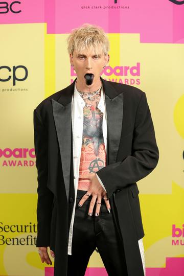 Machine Gun Kelly poses backstage for the 2021 Billboard Music Awards, broadcast on May 23, 2021 at Microsoft Theater in Los Angeles, California. (Photo by Rich Fury/Getty Images for dcp)