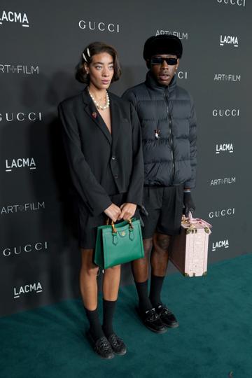 Reign Judge  and Tyler, the Creator, wearing Gucci, attend the 10th Annual LACMA ART+FILM GALA honoring Amy Sherald, Kehinde Wiley, and Steven Spielberg presented by Gucci at Los Angeles County Museum of Art on November 06, 2021 in Los Angeles, California. (Photo by Presley Ann/Getty Images for LACMA)