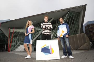 Bord Gáis Energy today unveiled the new designs created by Luke Reidy and inspired by the dynamic, angular shape of the theatre, which will feature across ambassador uniforms, customer merchandise and other in-theatre collateral.  Pictured alongside Luke are models Sarah Morrissey and Darren Regazzoli wearing the new uniform design. Photo: Leon Farrell/Photocall Ireland.