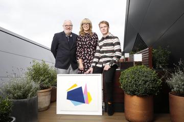 Bord Gáis Energy today unveiled the new designs created by Luke Reidy and inspired by the dynamic, angular shape of the theatre, which will feature across ambassador uniforms, customer merchandise and other in-theatre collateral.  Pictured alongside Luke are Stephen Faloon, General Manager of the Bord Gáis Energy Theatre and Tanya Townsend, Sponsorship Manager at Bord Gáis Energy. Photo: Leon Farrell/Photocall Ireland.