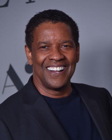 Denzel Washington, pictured here smiling, is in the running for Best Actor for his intense performance in 'The Tragedy of Macbeth' (Photo by LISA O'CONNOR / AFP) (Photo by LISA O'CONNOR/AFP via Getty Images)