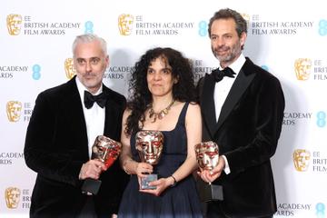 (L-R) Iain Canning, Tanya Seghatchian and Emile Sherman pose in the winners room with the award for Best Film for "Power of the Dog" during the EE British Academy Film Awards 2022 at Royal Albert Hall on March 13, 2022 in London, England. (Photo by Mike Marsland/WireImage)