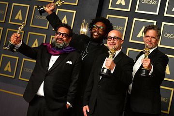 Best documentary feature winners for "Summer of Soul" (L-R) Joseph Patel, Ahmir "Questlove" Thompson, David Dinerstein and Robert Fyvolent pose in the press room during the 94th Oscars at the Dolby Theatre in Hollywood, California on March 27, 2022. (Photo by Frederic J. Brown / AFP) (Photo by FREDERIC J. BROWN/AFP via Getty Images)