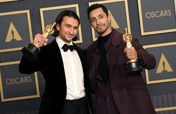 (L-R) Riz Ahmed and Aneil Karia, winners of Best Live Action Short Film "The Long Goodbye," pose in the press room during the 94th Annual Academy Awards at Hollywood and Highland on March 27, 2022 in Hollywood, California. (Photo by Jeff Kravitz/FilmMagic)