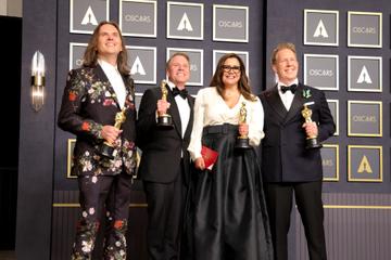 (L-R) Byron Howard, Clark Spencer, Yvett Merino and Jared Bush, winners of Animated Feature Film award for "Encanto," pose in the press room during the 94th Annual Academy Awards at Hollywood and Highland on March 27, 2022 in Hollywood, California. (Photo by Momodu Mansaray/WireImage)