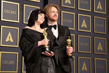 (L-R) American singer-songwriters Billie Eilish and FINNEAS, winners of the Oscar for Original Song for “No Time To Die” from “No Time to Die", pose in the press room during the 94th Annual Academy Awards at Hollywood and Highland on March 27, 2022 in Hollywood, California. (Photo by Momodu Mansaray/WireImage)