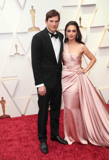 (L-R) Ashton Kutcher and Mila Kunis attend the 94th Annual Academy Awards at Hollywood and Highland on March 27, 2022 in Hollywood, California. (Photo by David Livingston/Getty Images)