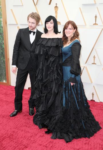 (L-R) FINNEAS, Billie Eilish, and Maggie Baird attend the 94th Annual Academy Awards at Hollywood and Highland on March 27, 2022 in Hollywood, California. (Photo by David Livingston/Getty Images)