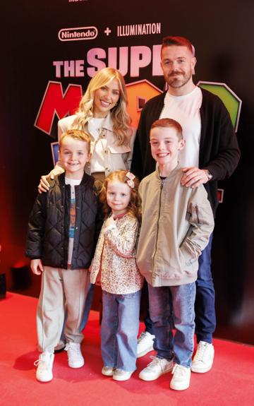 Rossie Connolly and Paul Quinn with children  Harry (8) Remi (4) and Reuben (10) pictured at the Irish premiere screening of The Super Mario Bros. Movie at Light House Cinema, Dublin. The Super Mario Bros. Movie is in cinemas from Wednesday April 5th. Picture Andres Poveda
 