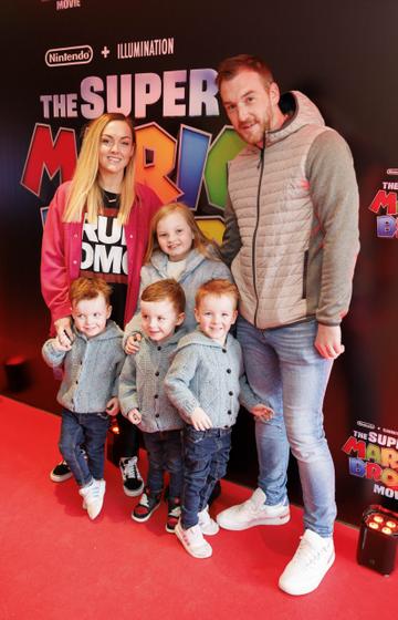 Ali and Chris Deasy with Georgia (7),Ted, Lenny and Bruce (3) pictured at the Irish premiere screening of The Super Mario Bros. Movie at Light House Cinema, Dublin. The Super Mario Bros. Movie is in cinemas from Wednesday April 5th. Picture Andres Poveda
 