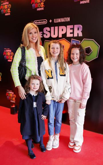 Jenny Buckley with daughters Bow (5) and Jude (11) and Anna Ryan (11) pictured at the Irish premiere screening of The Super Mario Bros. Movie at Light House Cinema, Dublin. The Super Mario Bros. Movie is in cinemas from Wednesday April 5th. Picture Andres Poveda
 