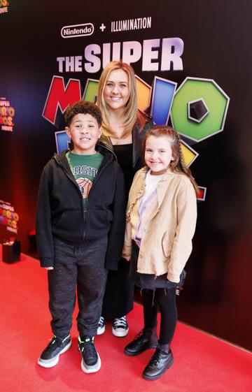 Jeniifer Carroll, Carter Carroll (7) and Erin McCormack (8)  pictured at the Irish premiere screening of The Super Mario Bros. Movie at Light House Cinema, Dublin. The Super Mario Bros. Movie is in cinemas from Wednesday April 5th. Picture Andres Poveda
 
