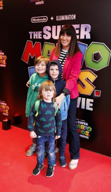 Melanie Finn with children Rian (9) Liam (8) and Patrick Murphy (4) at the Irish premiere screening of The Super Mario Bros. Movie at Light House Cinema, Dublin. The Super Mario Bros. Movie is in cinemas from Wednesday April 5th. Picture Andres Poveda
 