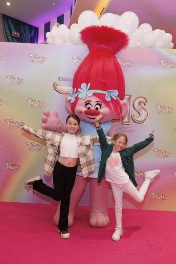 Grace Byrne (7) and Alex Boland (7) pictured with Poppy at a special preview screening of Trolls Band Together at Movies@ The Square, Dublin. Trolls Band Together is in cinemas next Friday October 20th. Picture Andres Poveda