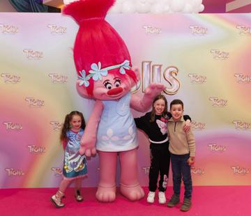 Grace Keane (5) Sarah McDonagh and Oisin Keane (7) from Rathcoole pictured with Poppy at a special preview screening of Trolls Band Together at Movies@ The Square, Dublin. Trolls Band Together is in cinemas next Friday October 20th. Picture Andres Poveda